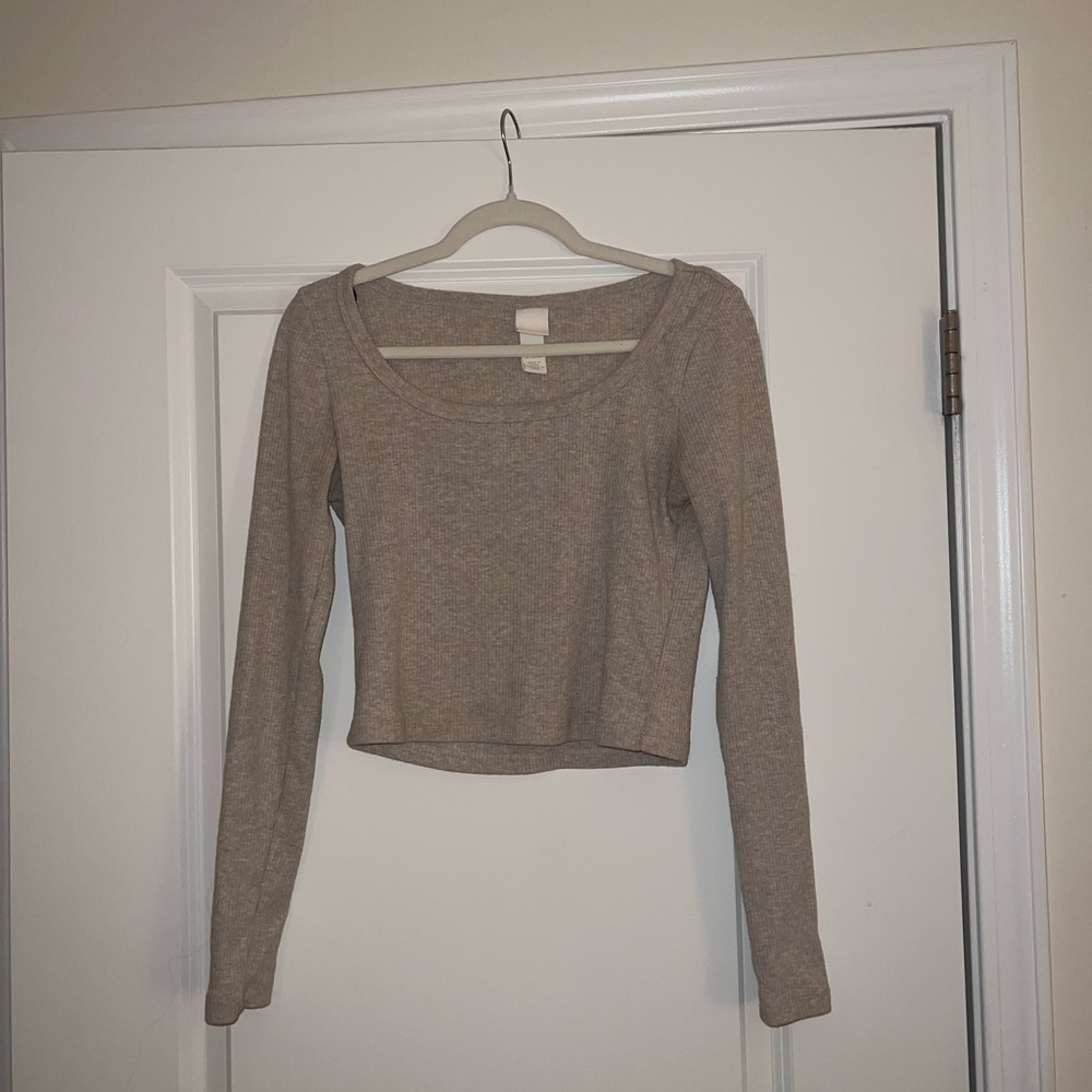 Long sleeve light brown shirt. Size medium and brand is h&m
